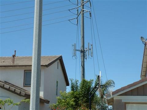 Sprint PCS antennas on a power pole - very close to nearby homes.